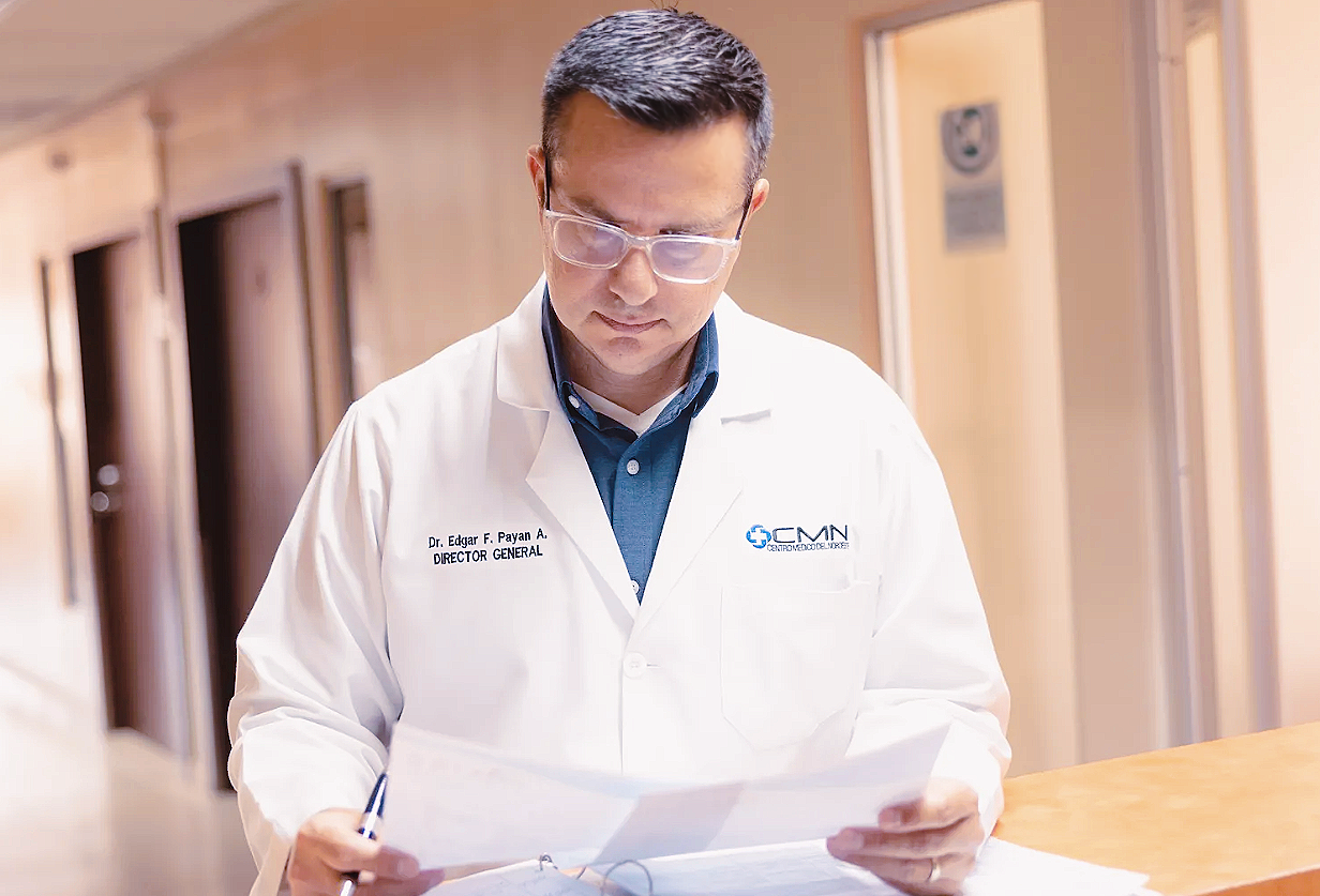 Dr. Edgar Payan at CMN Hospital reading patient records