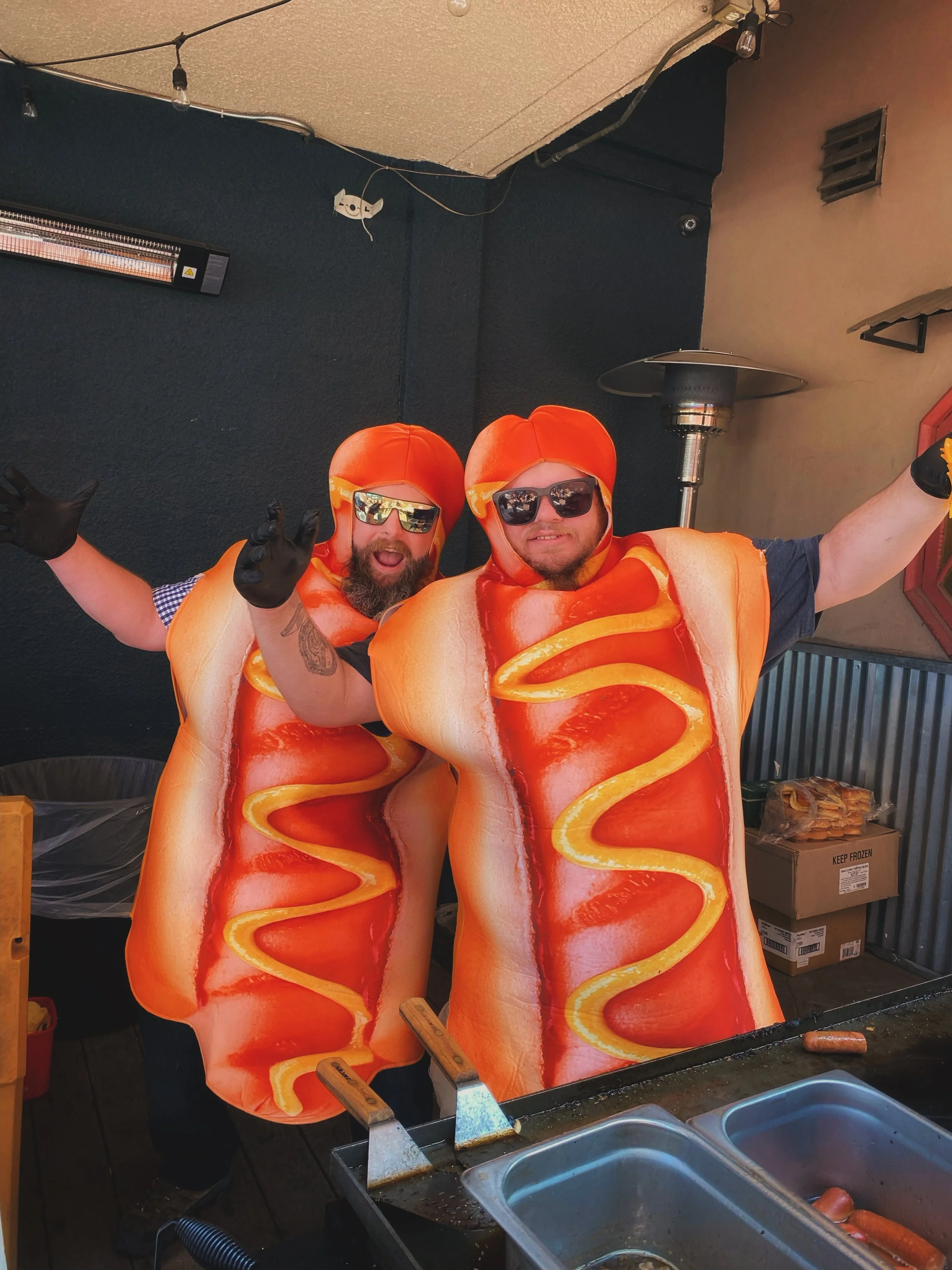 🌭🔥 Have you seen these two HOT Dawgs serving up hot dogs and sliders on the patio?

Nick and Pickles are out here dressed for the occasion, serving up dogs, sliders, tunes, and peak 4th of July patio energy.

Come drop in, cool off, grab a bite, an