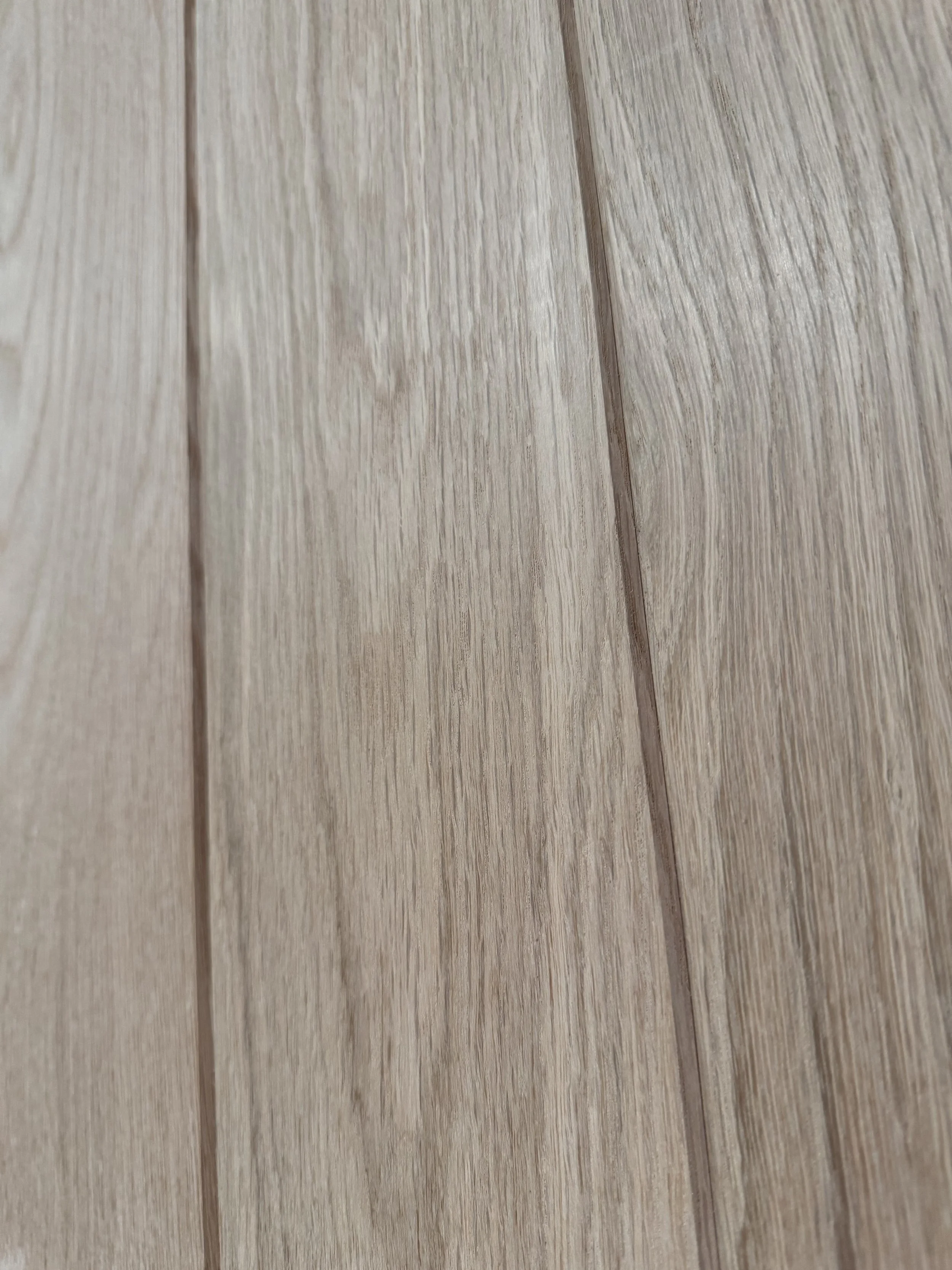 Close-up of wooden floorboards with a light natural finish.