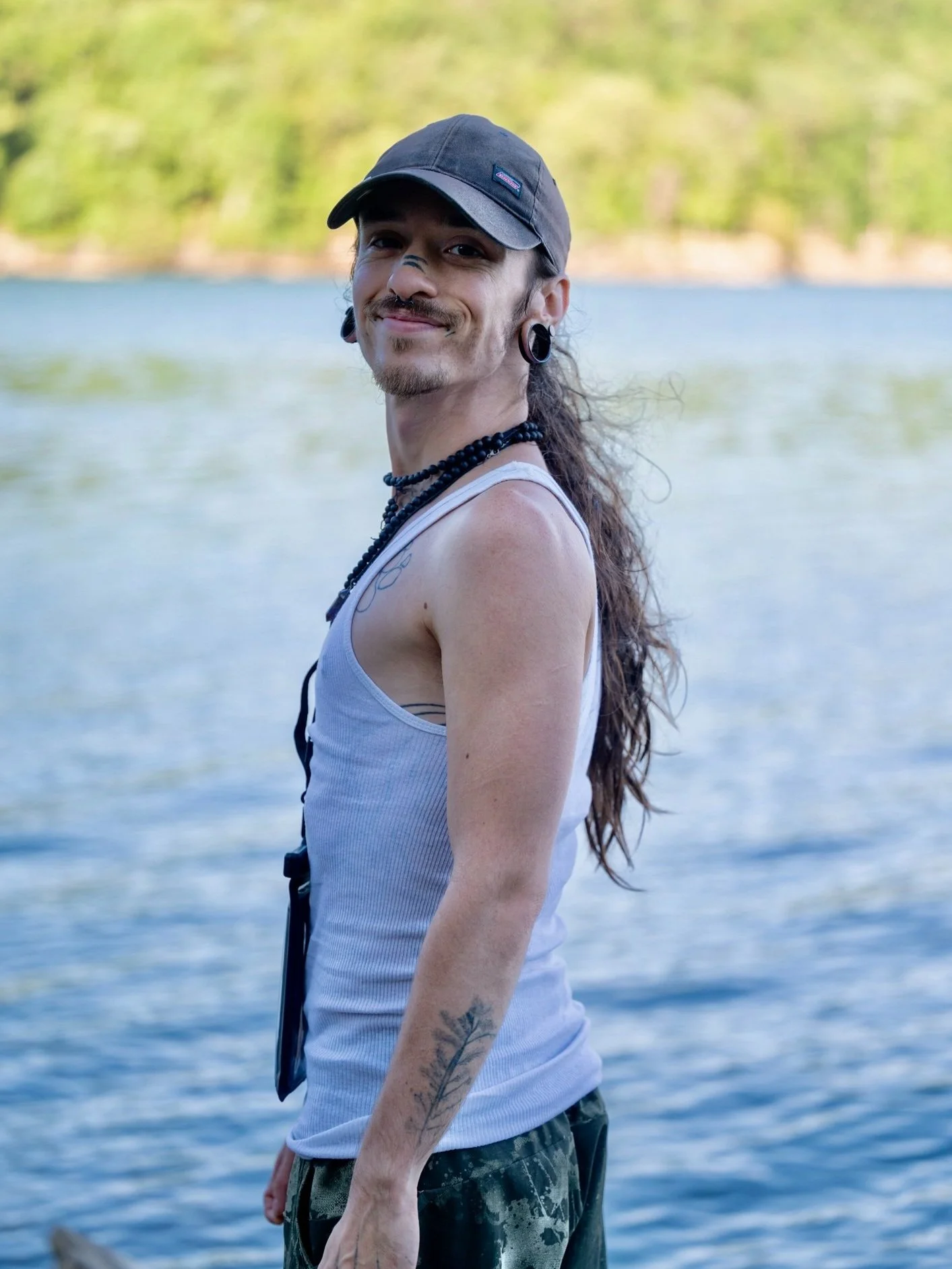 Man enjoying the lakefront at Beaver Lake in Eureka Springs, Arkansas, near SUP Outfitters.