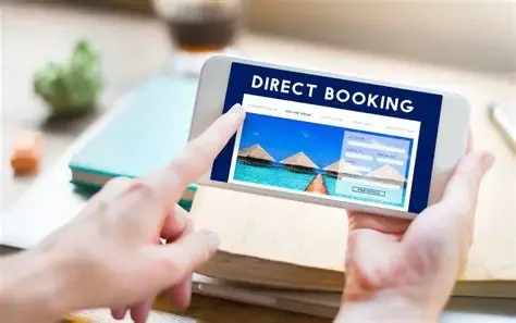 Person holding a smartphone displaying a booking website for tropical beach huts.