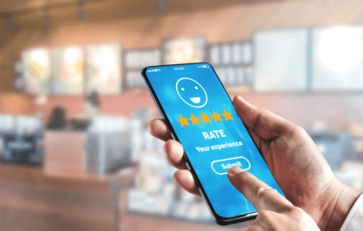 Cellphone with "rate your experience" text on screen