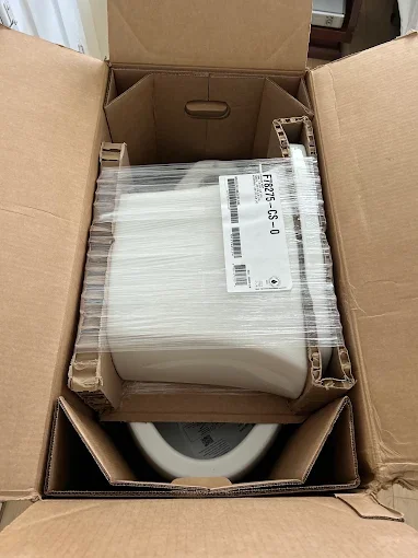 Packaged plumbing fixture