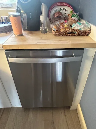Dishwasher beneath countertop