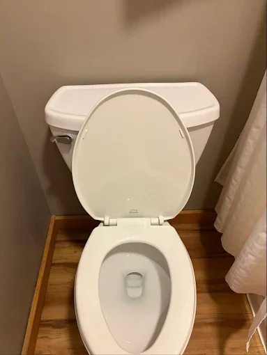 Toilet with seat raised