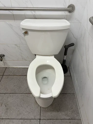 Toilet in tiled bathroom