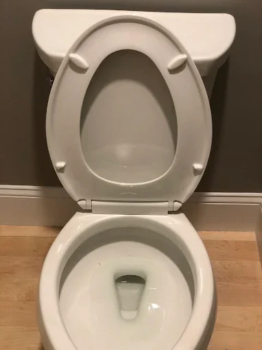 Toilet with seat raised