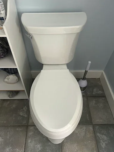 White toilet beside sink