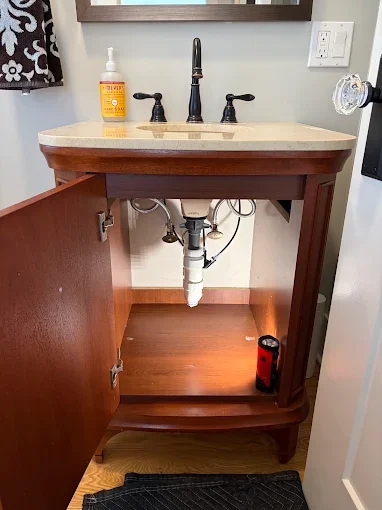 Vanity sink and drain piping