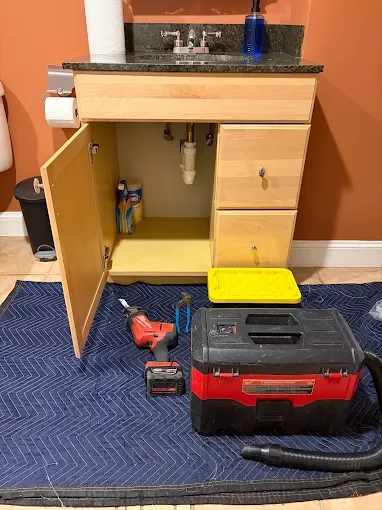 Vanity cabinet and plumbing tools