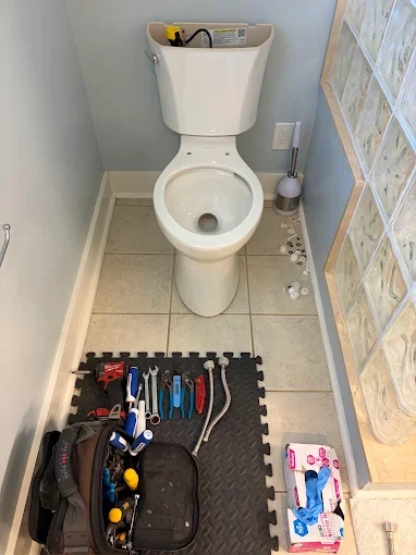 Toilet with plumbing tools