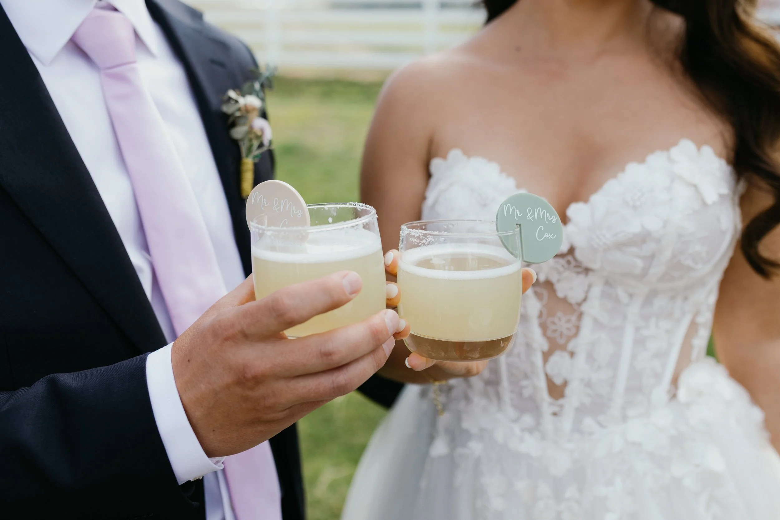 Bride and groom share a drink