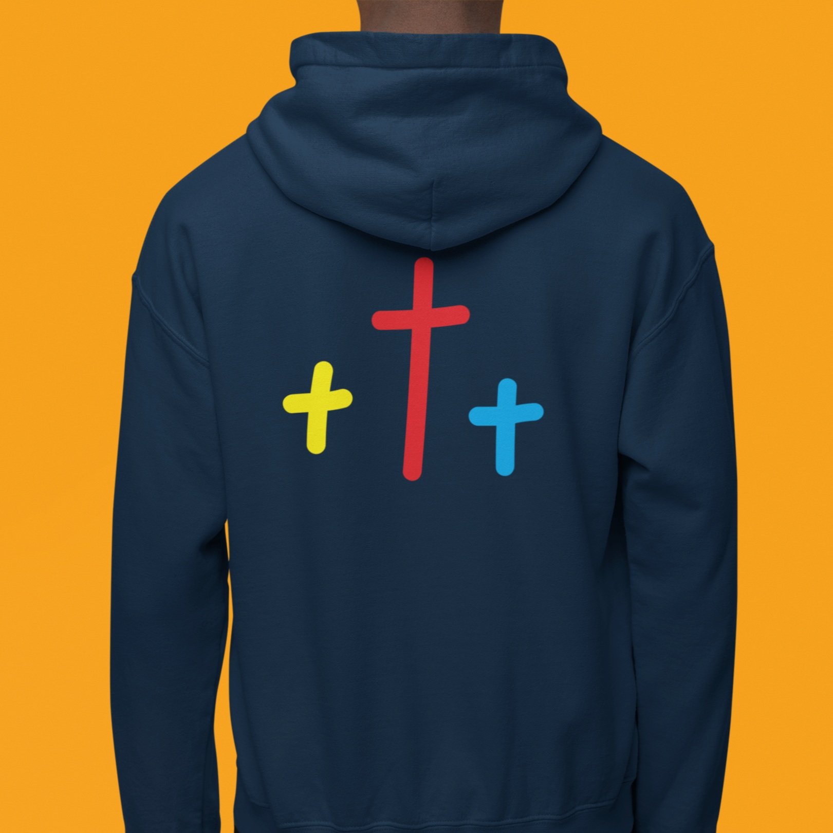 orange background back view black man wearing navy hoodie with three crosses yellow red and blue centered on back