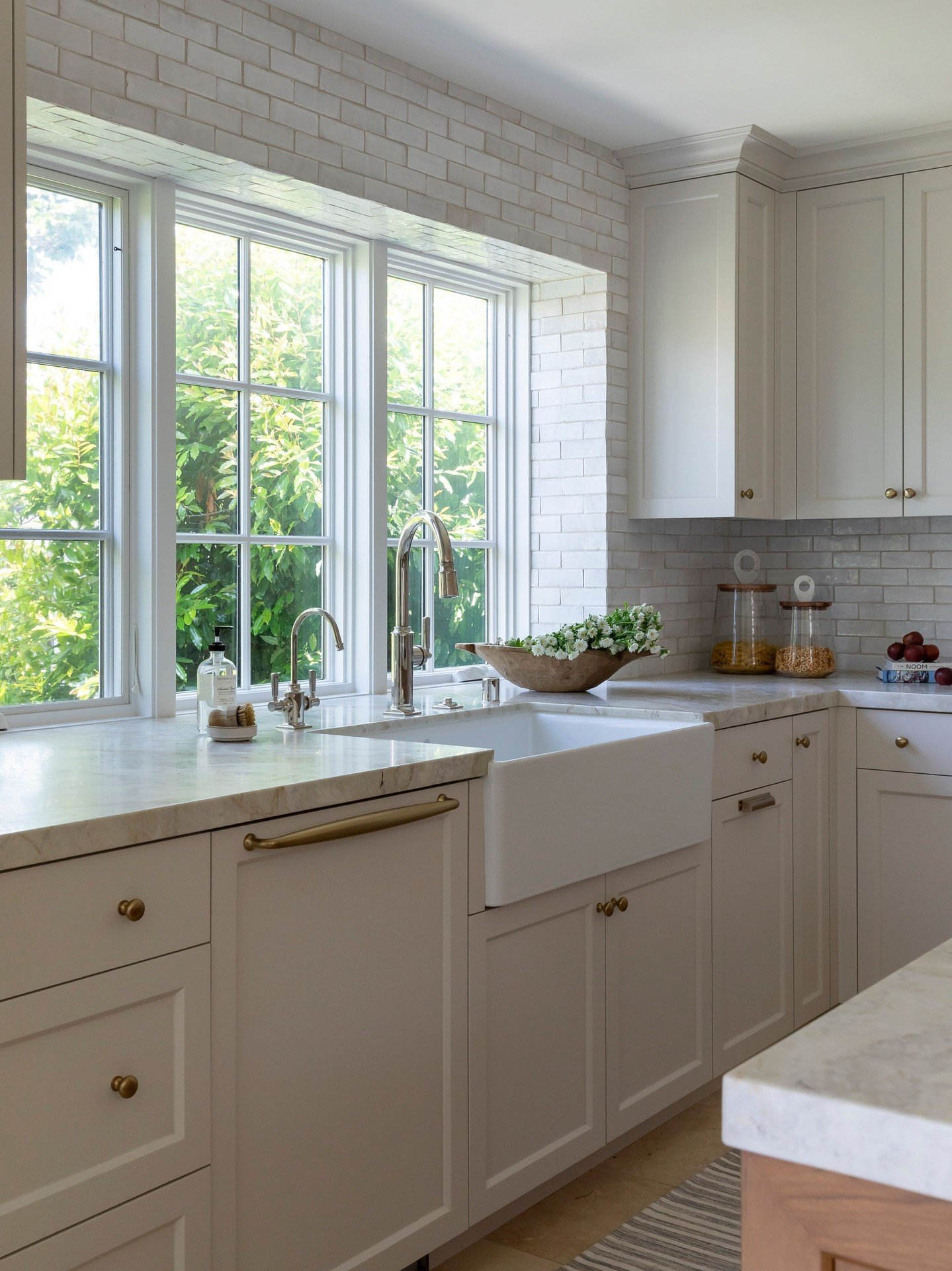 Luxury meets functionality in this open-concept kitchen&mdash;designed for both cooking and simultaneous entertaining. The island seating invites conversation while you prep, and the adjacent custom cabinet keeps your essentials discreetly tucked awa