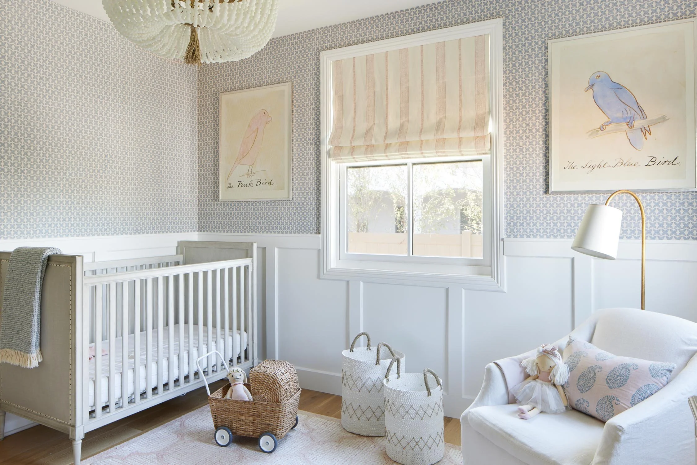 Modern nursery with white chair by Manhattan Beach interior designer Jennifer Harkavy