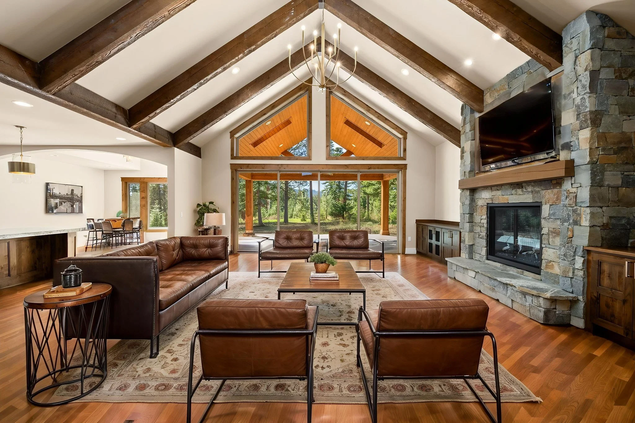 Where rustic craftsmanship meets refined mountain living.

Vaulted ceilings, exposed timber beams, a floor-to-ceiling stone fireplace, and views that bring the outdoors in, every detail is designed to feel warm, elevated, and timeless.

Ready to buil