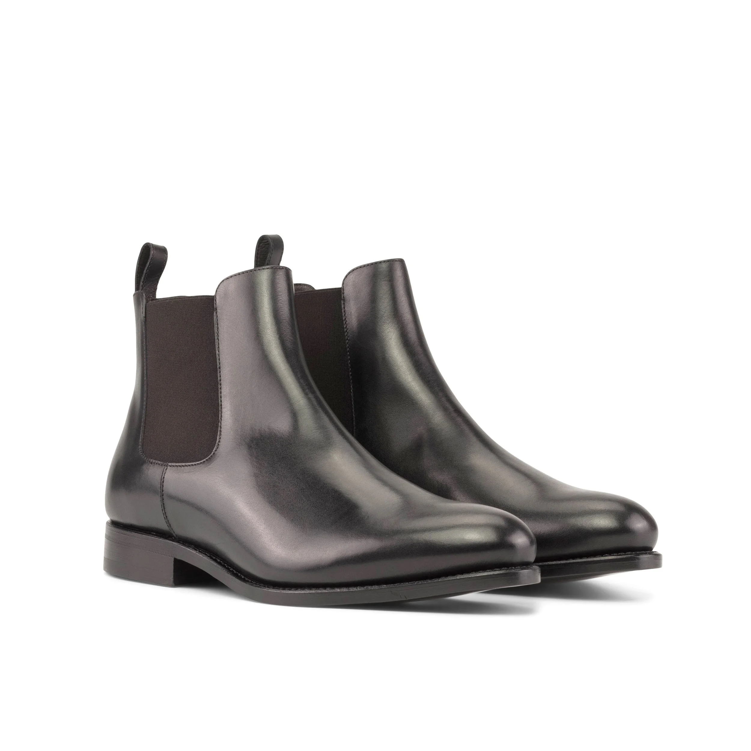 Black leather Chelsea boots with elastic side panels and low heel.