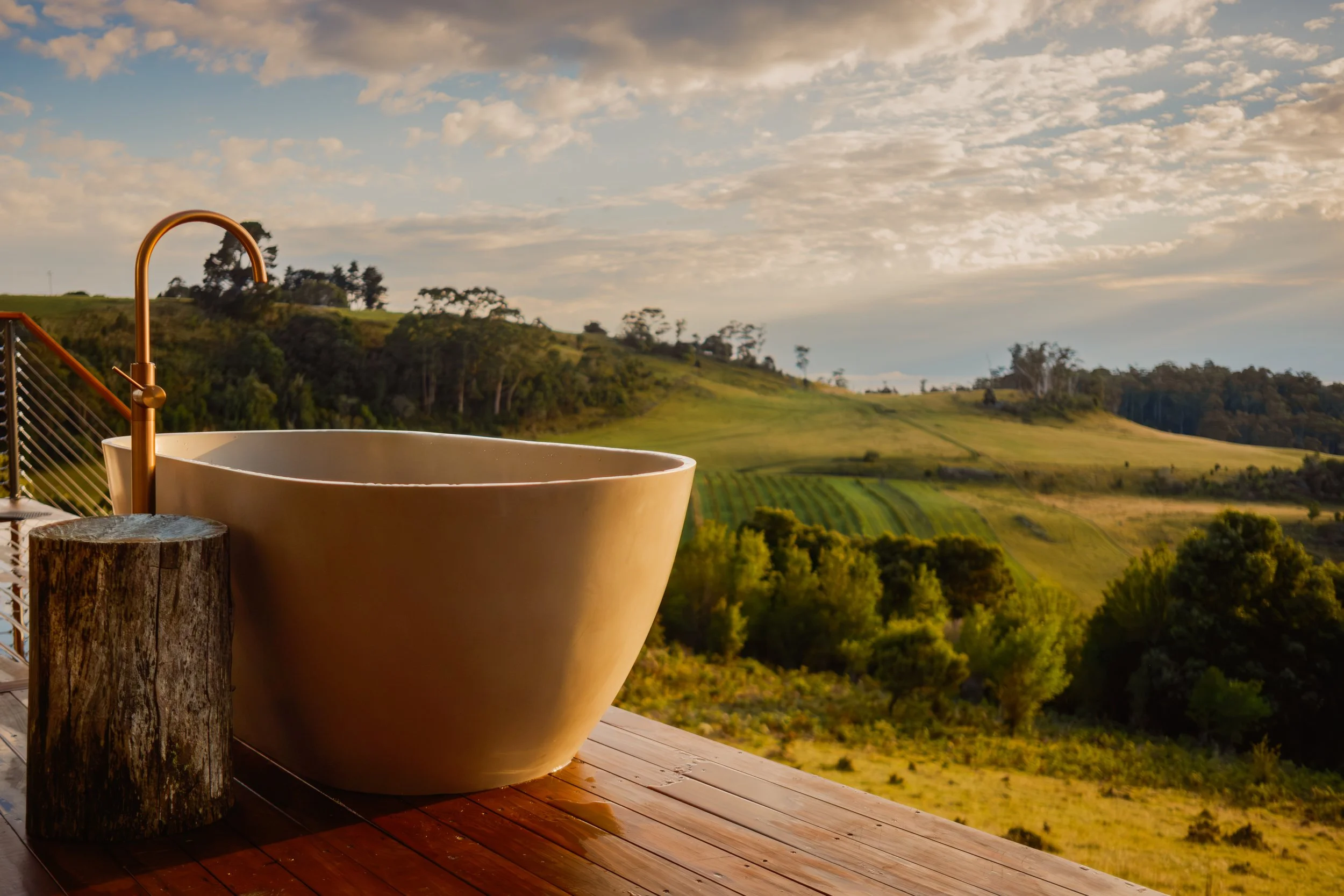 Outdoor bath with ocean views Tasmanian off grid tiny home