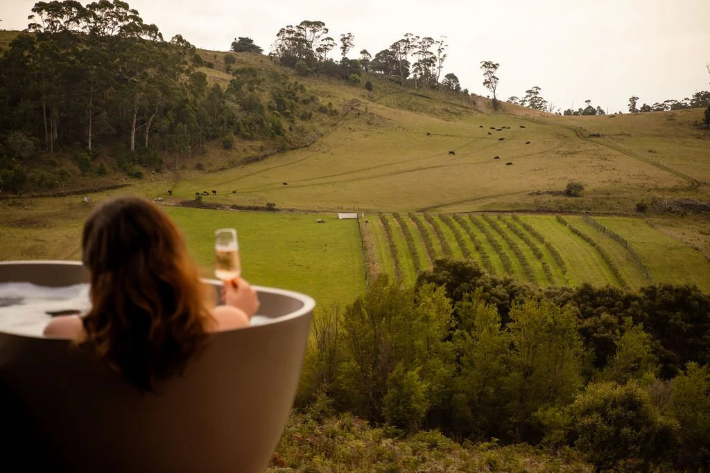 The outdoor stone bathtub is perfect for a relaxing afternoon in nature. 