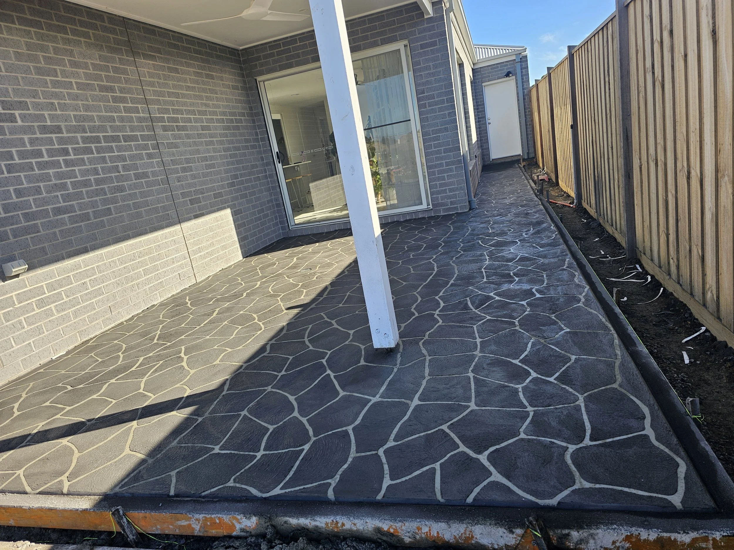 Unique stenciled coloured concrete installed by local concreting company of geelong