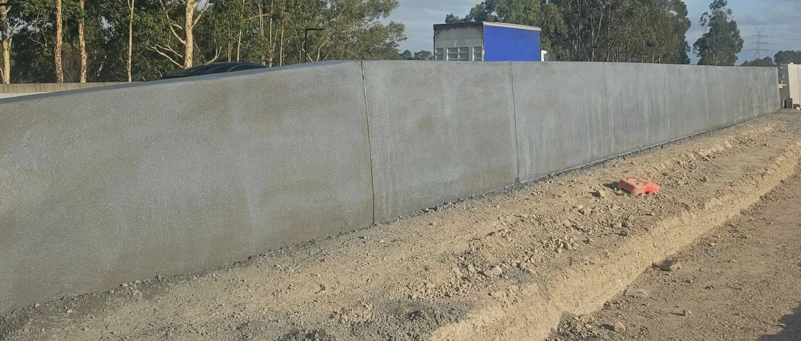 Continuous slipform barrier  F Type TL3 TL4 TL5 installation in New south wales for transport civil projects