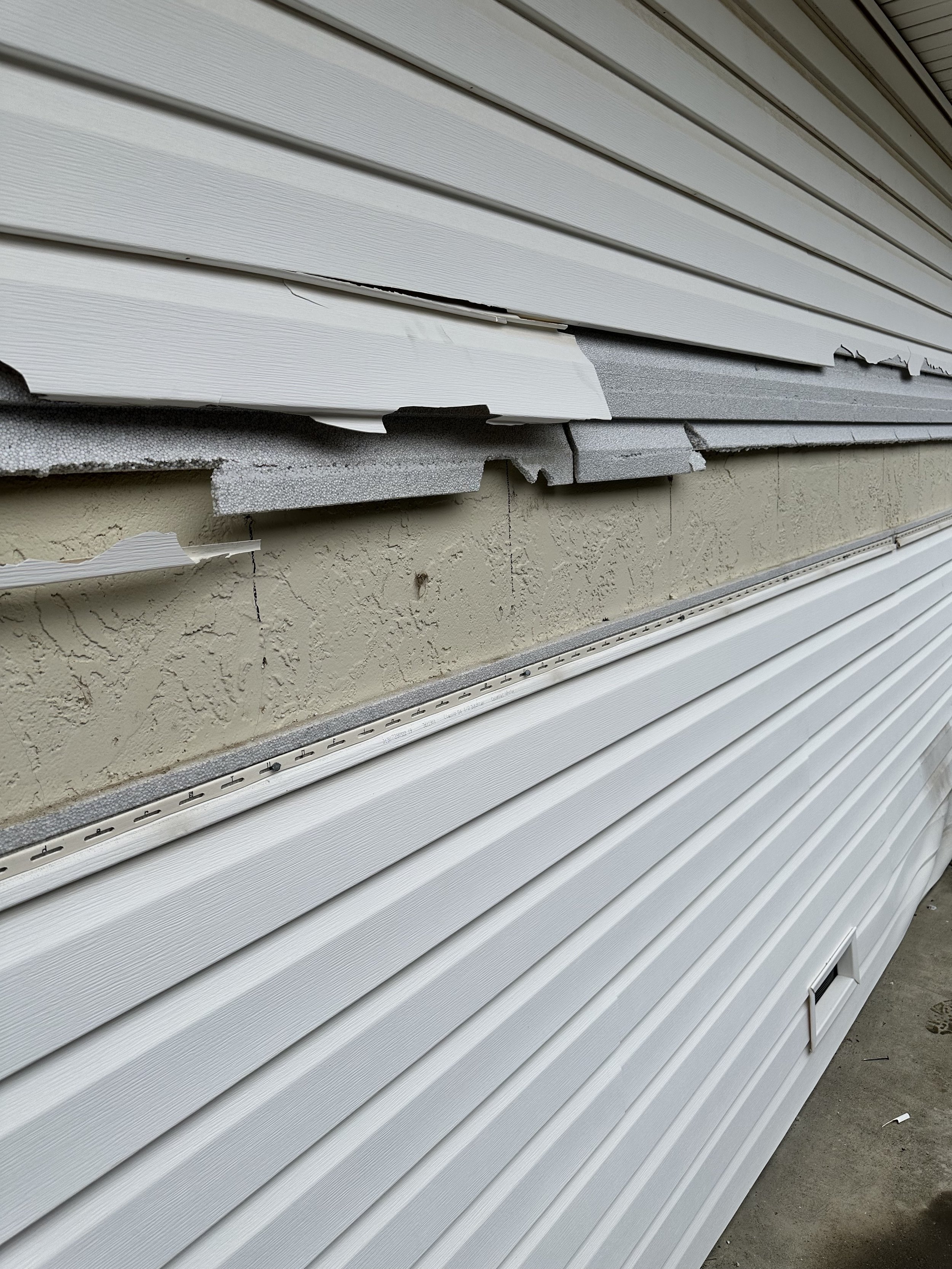 damaged siding indicating need of repair