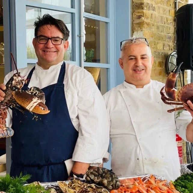 Chefs Holding Lobsters