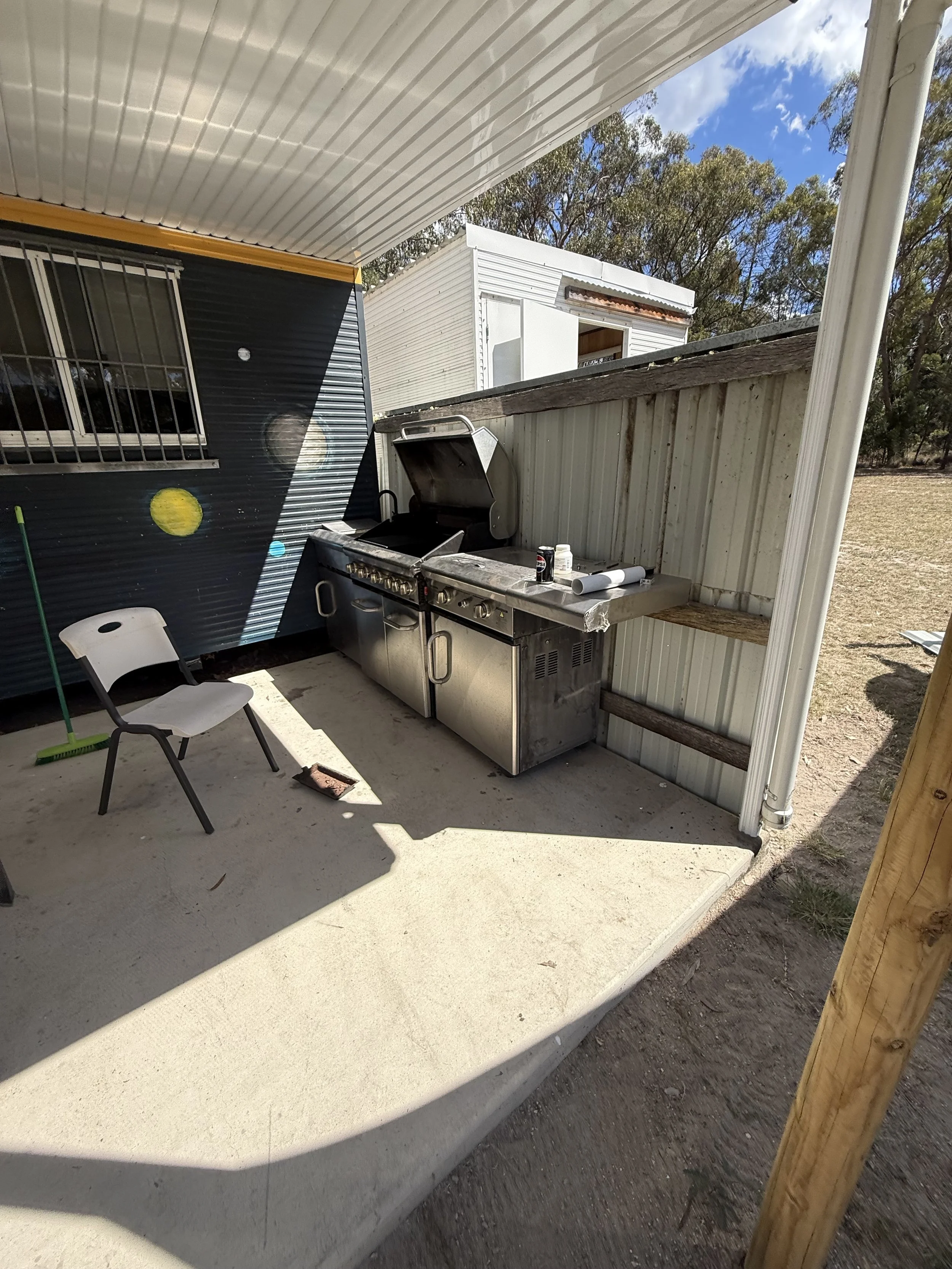 Outdoor barbecue area construction including wall build, barbeque installation and sink tap fitting and drainage.