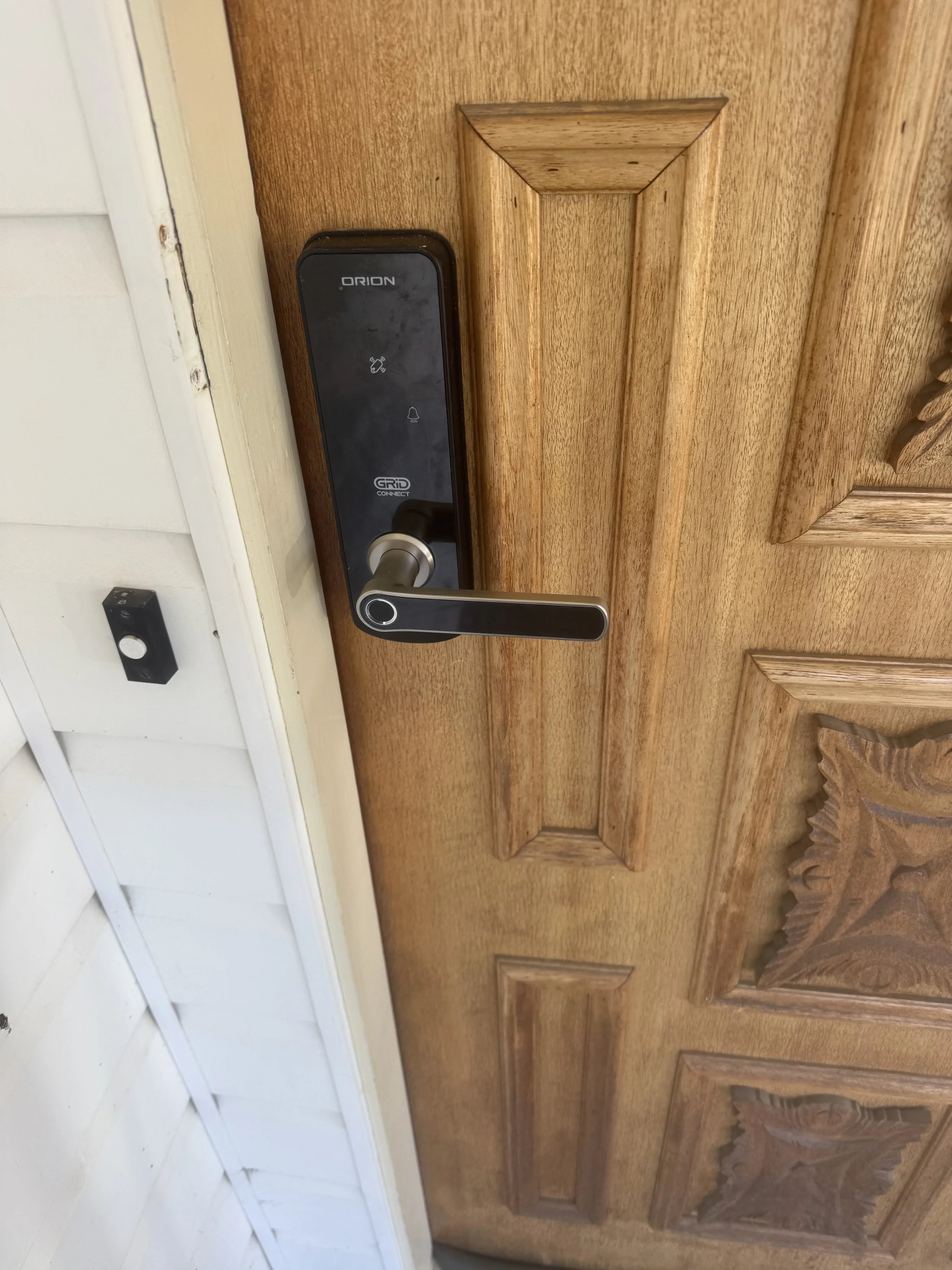 Electronic entrance door lock installation for keyless property access.