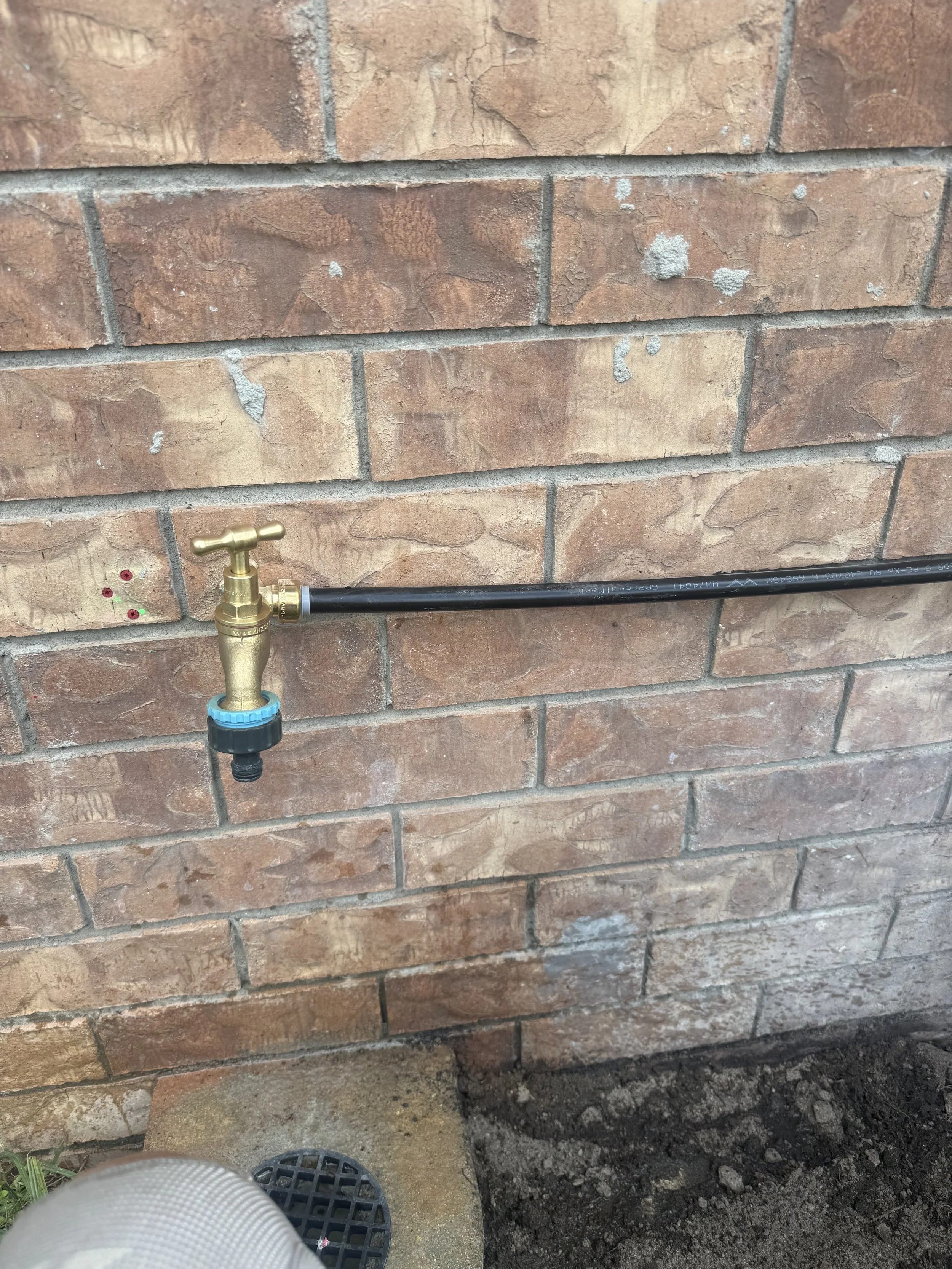 Outdoor tap relocation and plumbing maintenance to suit existing drainage and property layout.