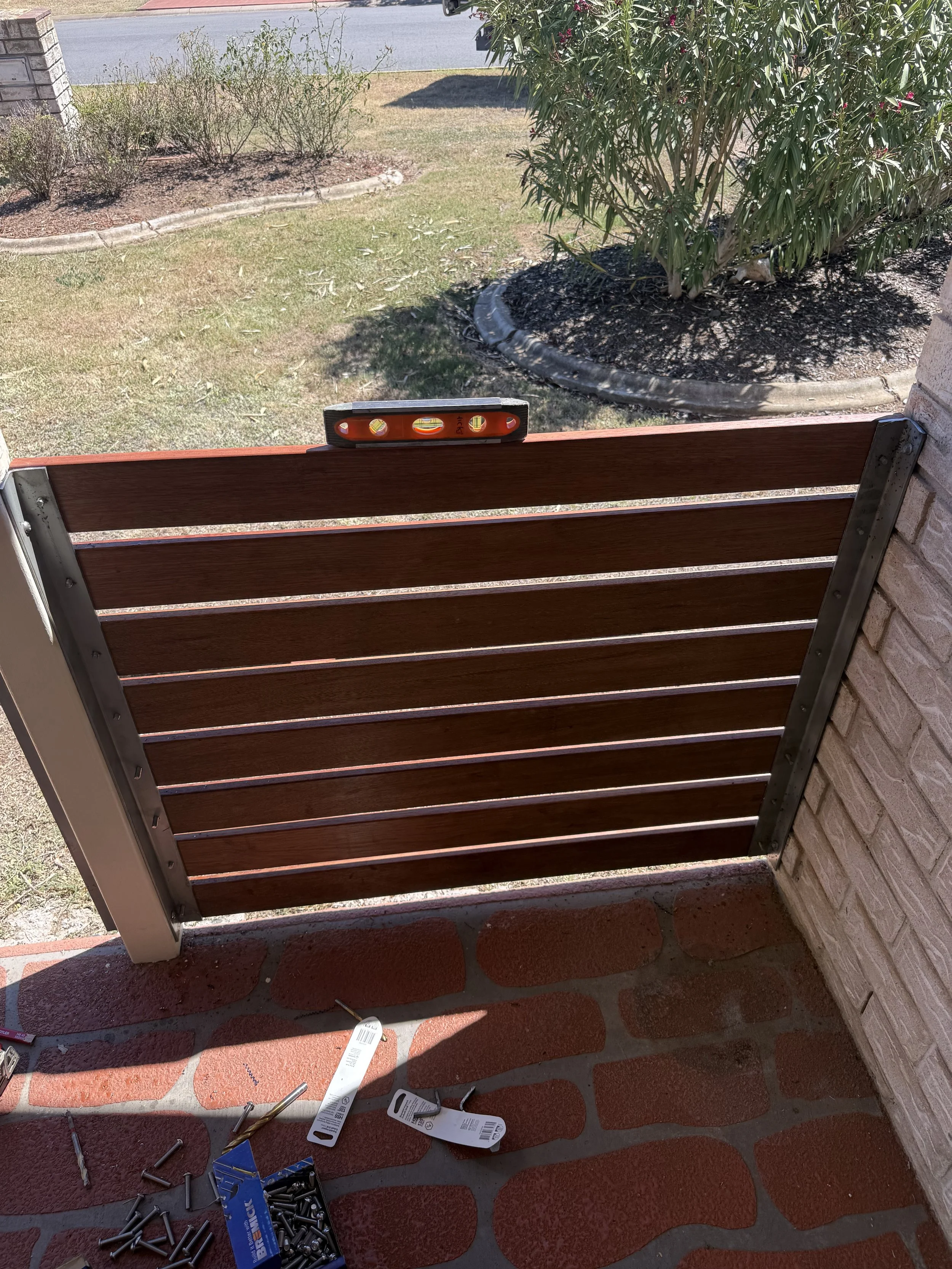 Front veranda fencing installation to improve safety and access around the porch area.