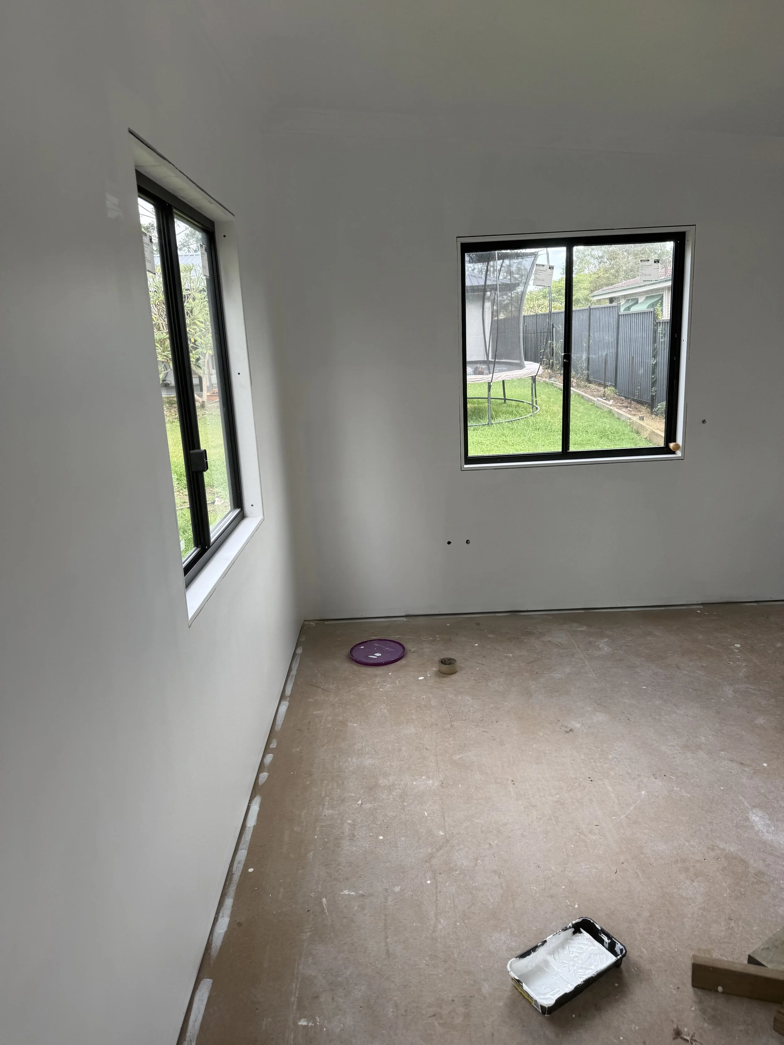 Second coat of undercoat applied to tiny home ceiling and walls in preparation of final painting.