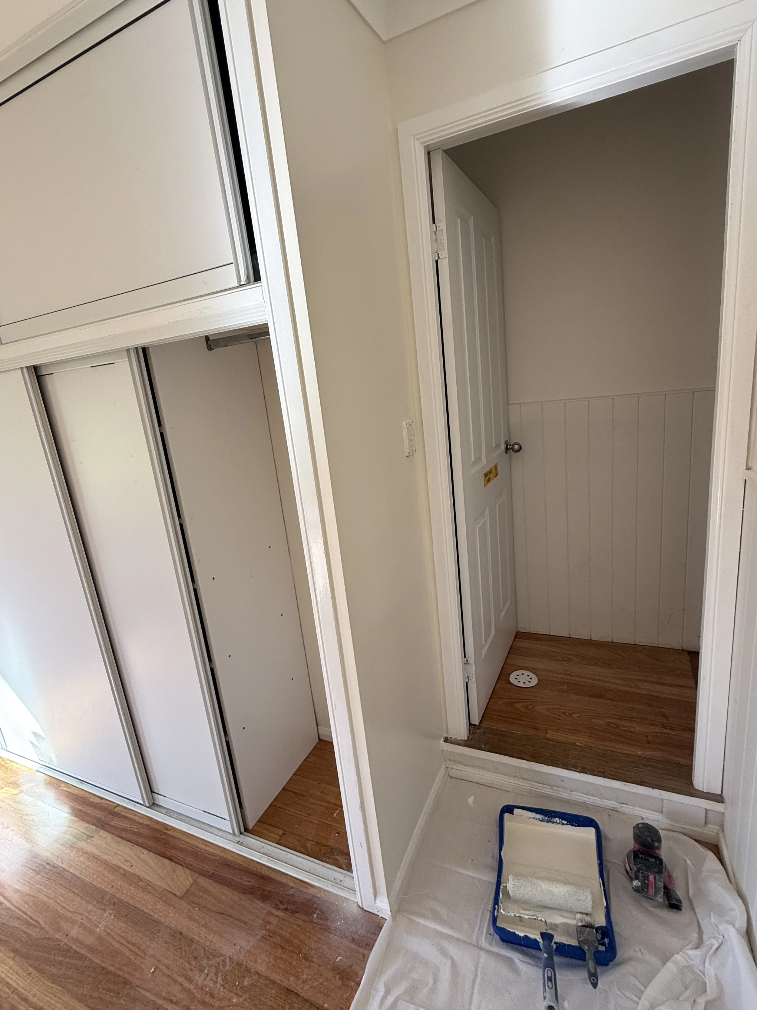 Built - in cabinet wall repair plaster finishing and repainting.