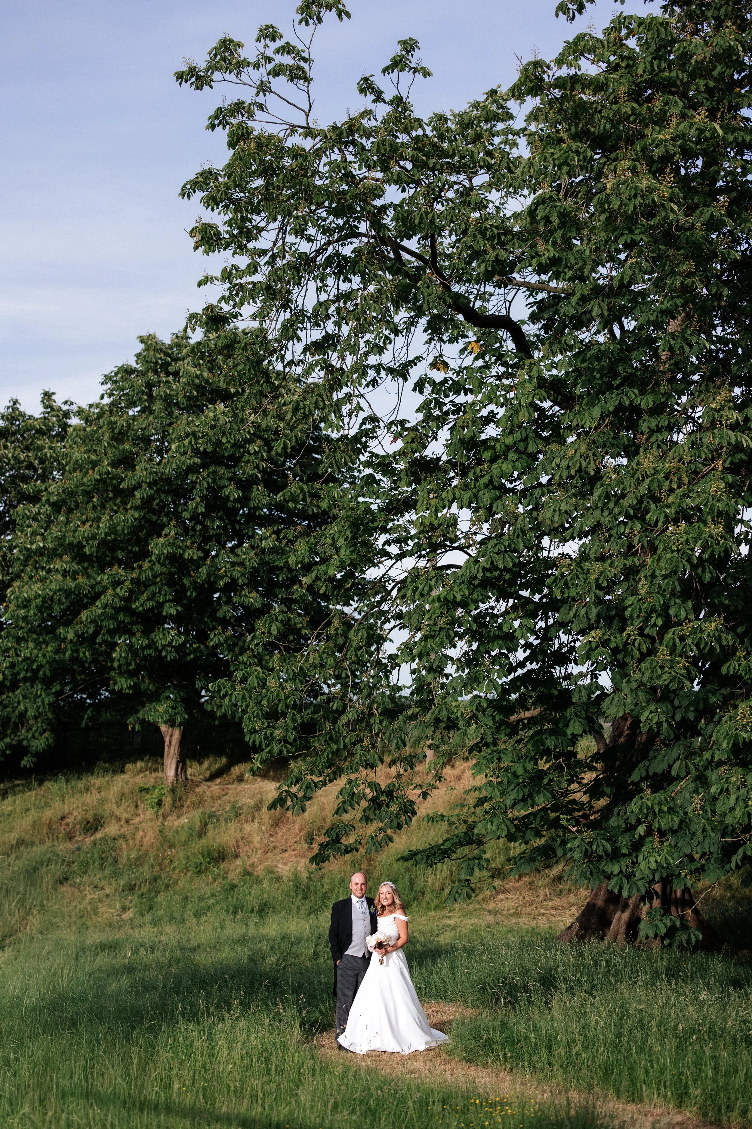 Bride and Groom Under Conker Tree