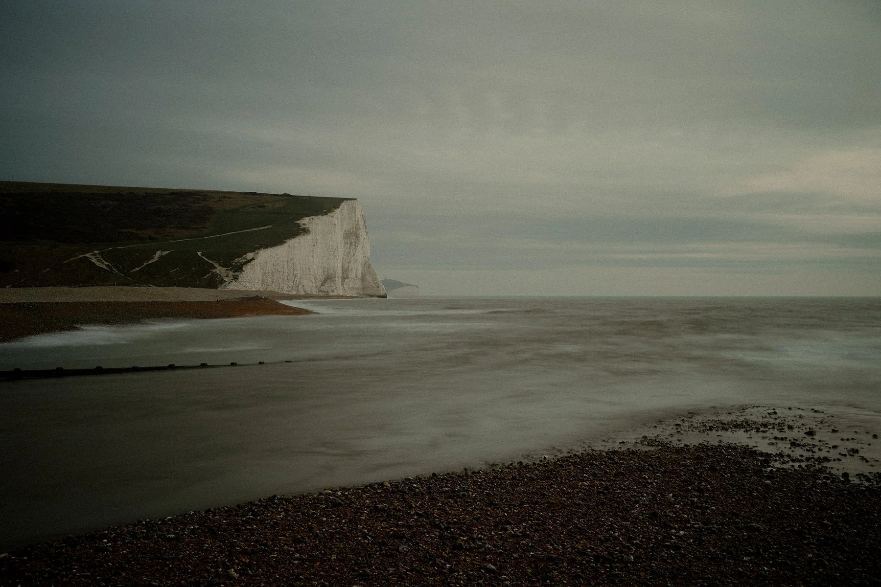 The Seven Sisters cliffs at Cuckmere Haven, East Sussex, England, UK. These famous cliffs in the South Downs National Park run between the mouth of the River Cuckmere, near Seaford and the chalk headland of Beachy Head, near Eastbourne.