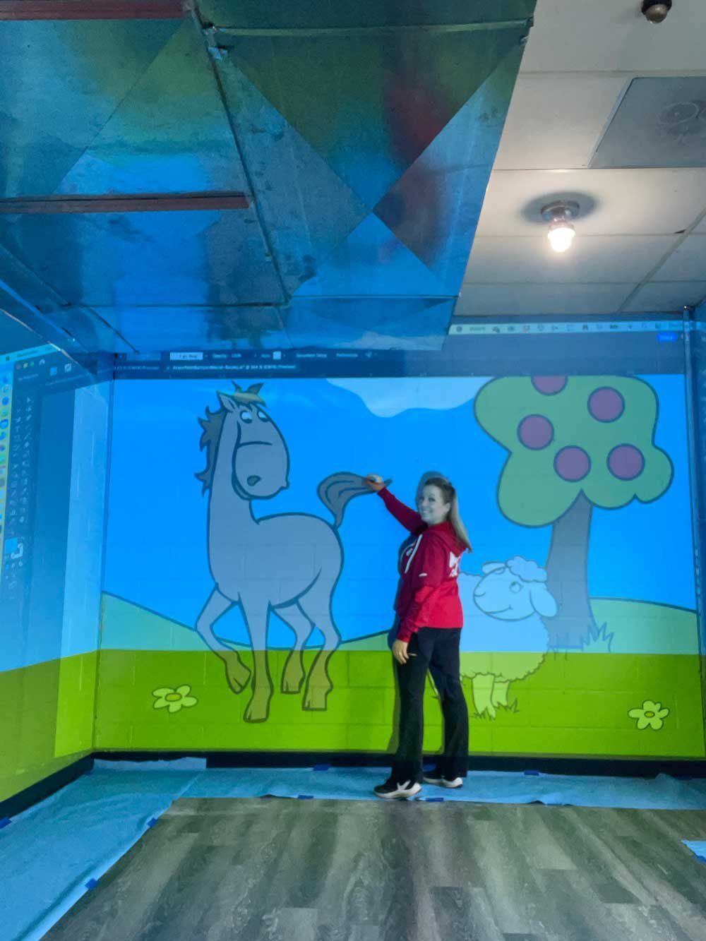 I projected my designs onto each wall and drew the outlines with chalk
