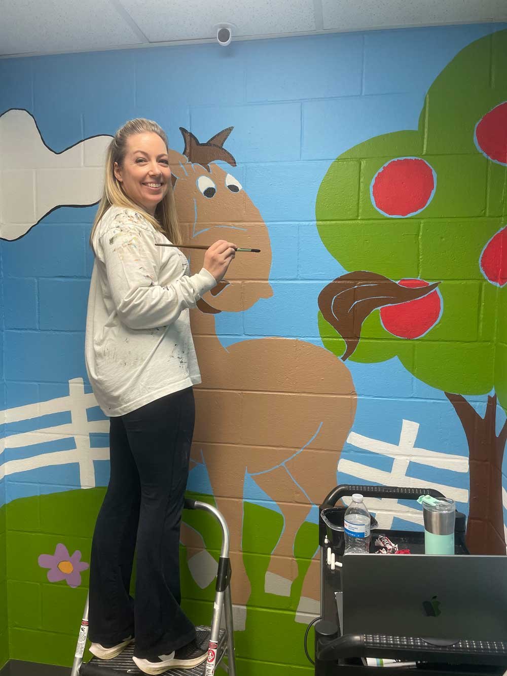 Painting outlines on all of the artwork
