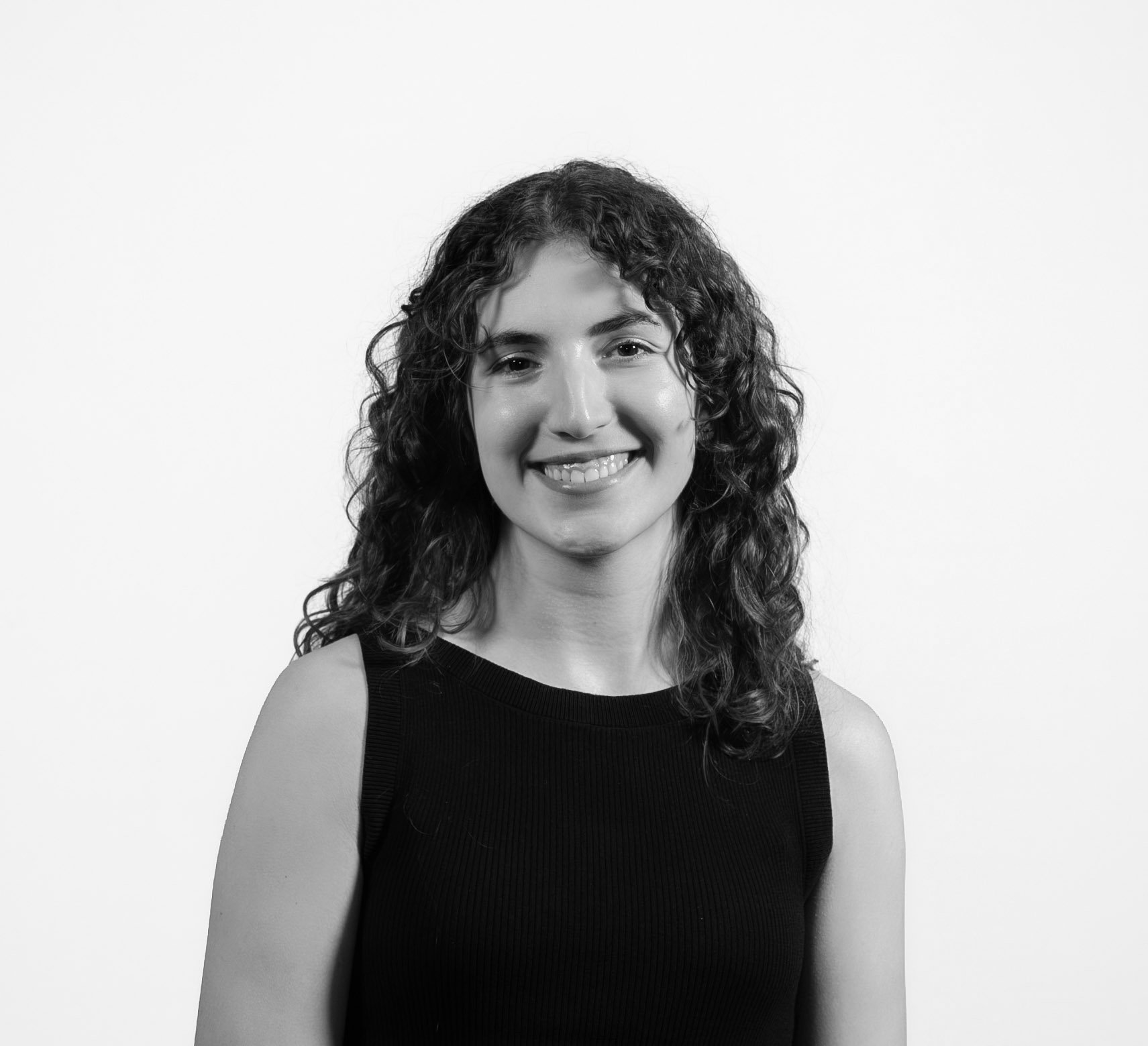 Headshot of Julia McGuigan, smiling looking forward