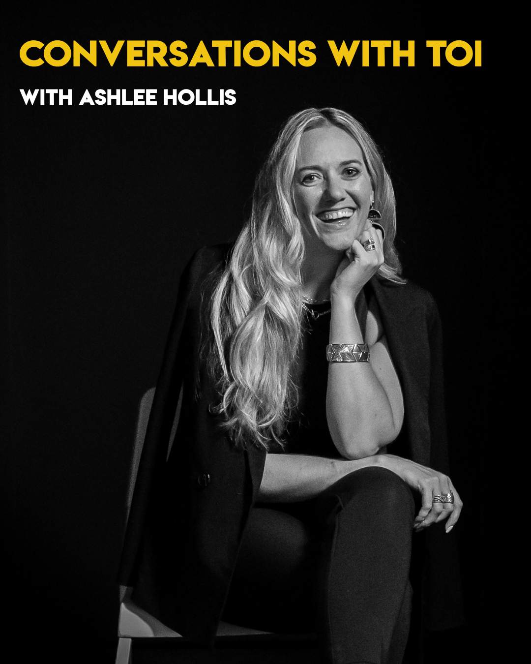 A graphic with Ashlee Hollis, a black and white photo where she's smiling with a fist on her chin