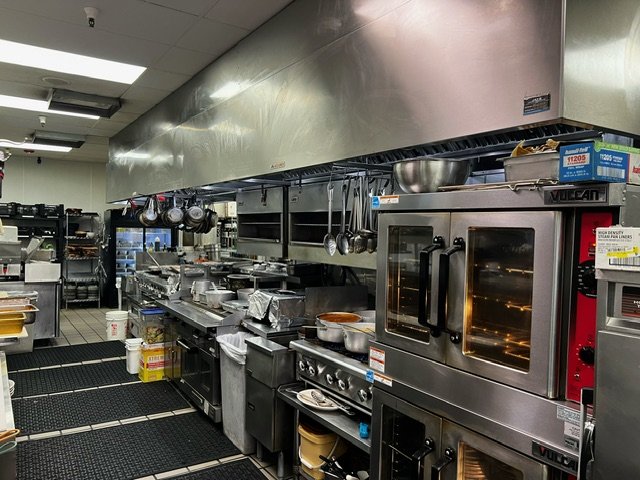  renovated kitchen workspace with cooking equipment and appliances at Enrique's Mexican Restaurant 