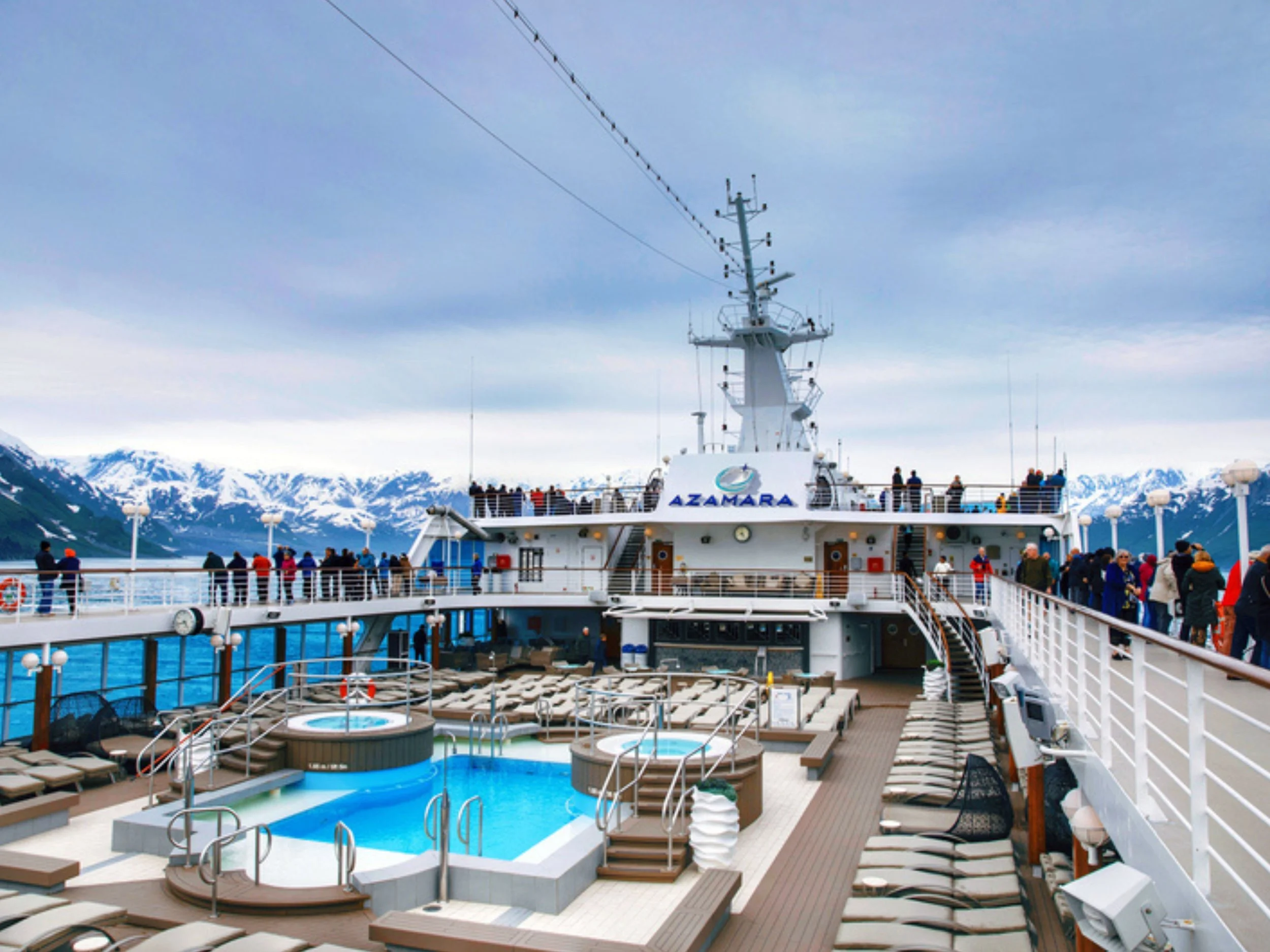 Azamara Cruises ship deck overlooking Alaska coastline with mountain views