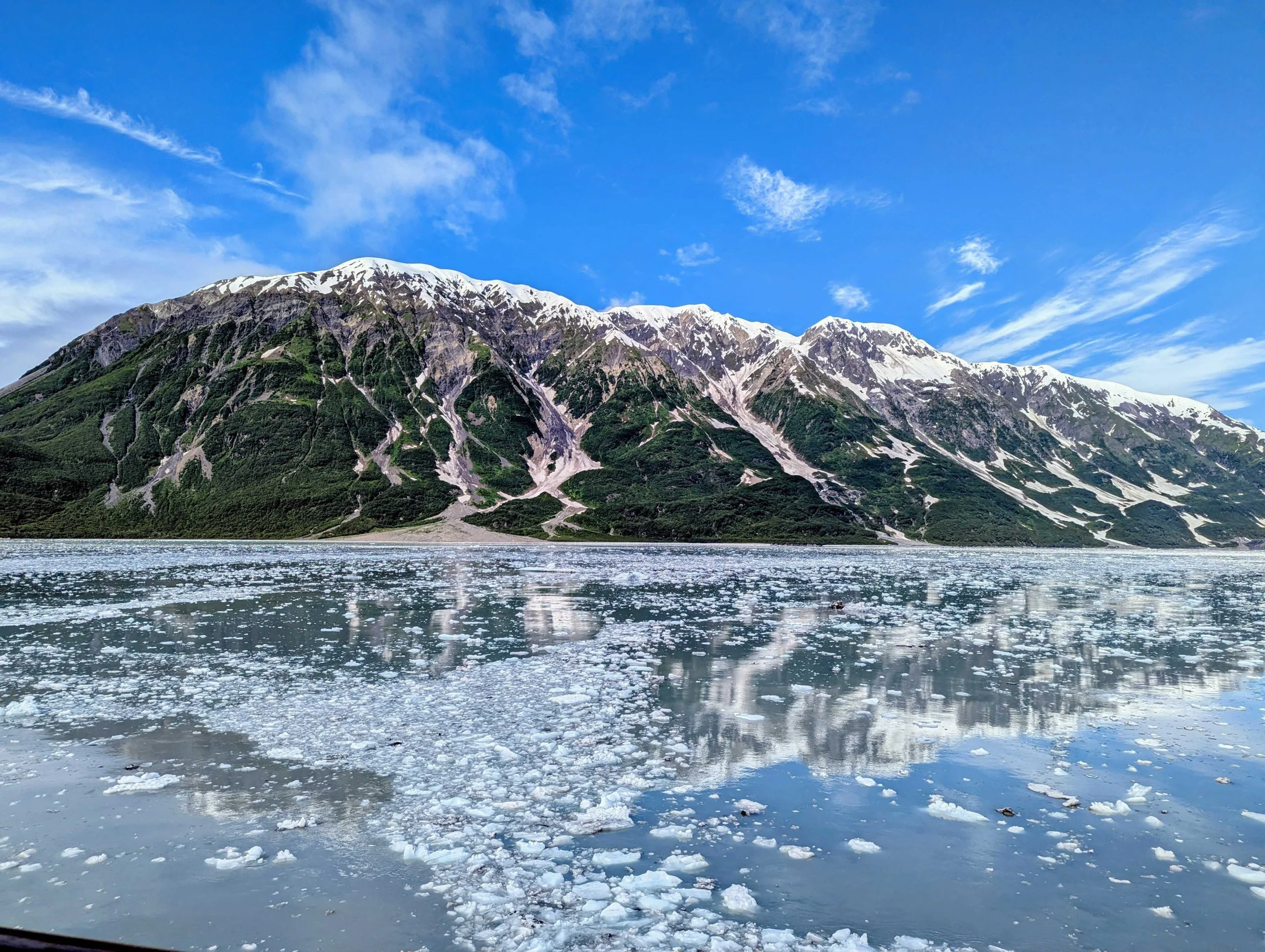 Dramatic Alaska Hubbard Glacier scenery with glacier and snow-capped mountains