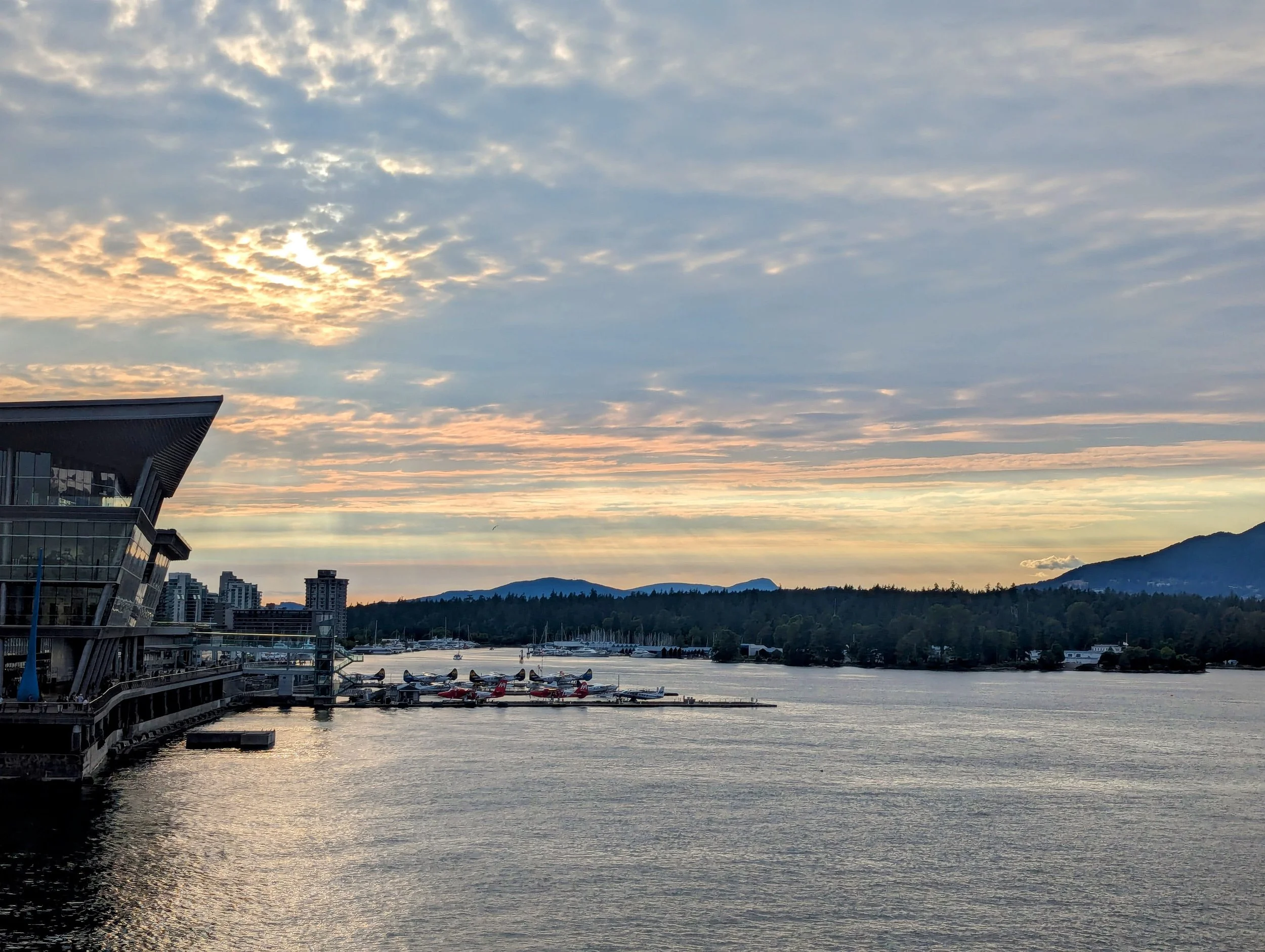 The sun setting over Canada Place and the float plane dock.
