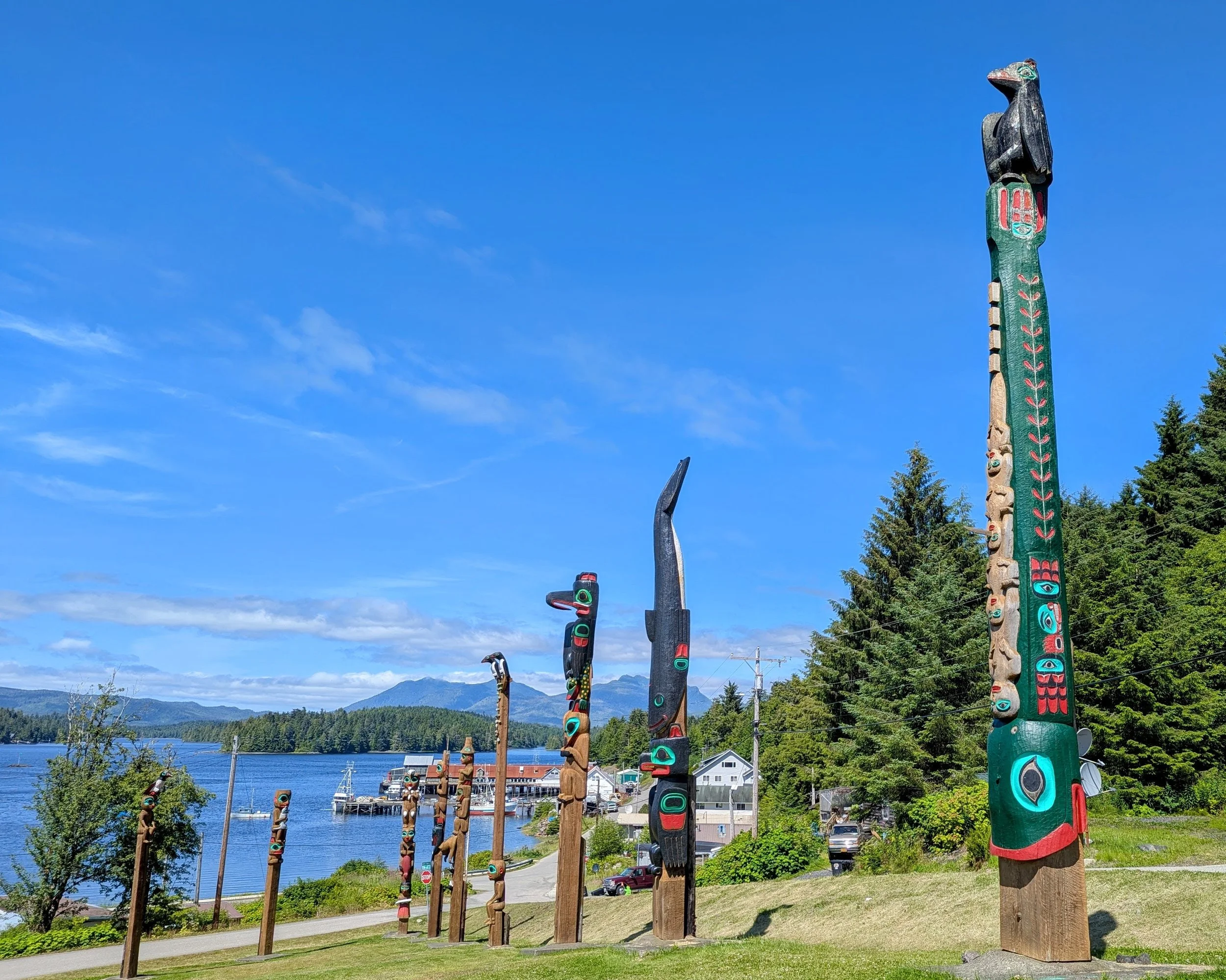 Historic totem poles in a park on a hill in Klawock