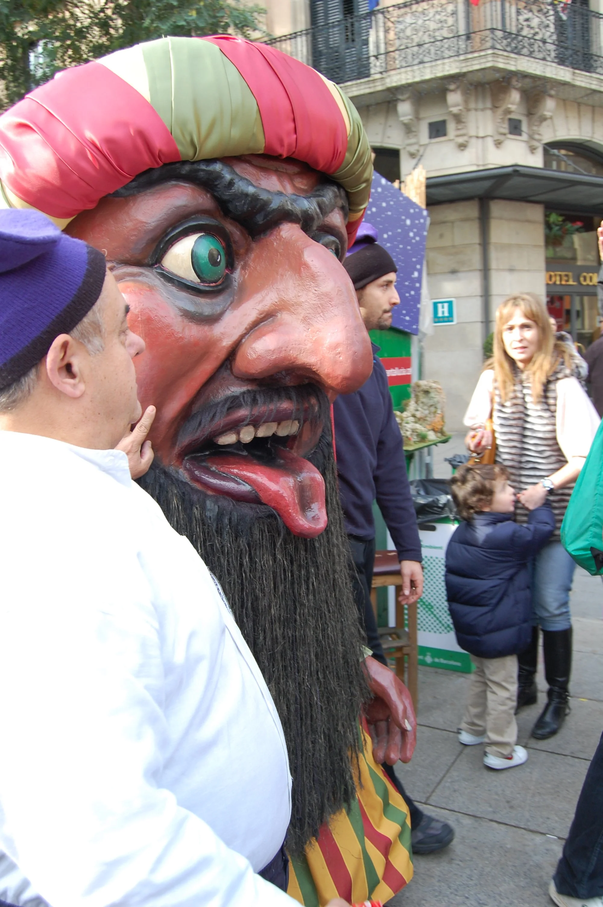 Holiday Christmas market in Barcelona with festive characters and local celebrations.