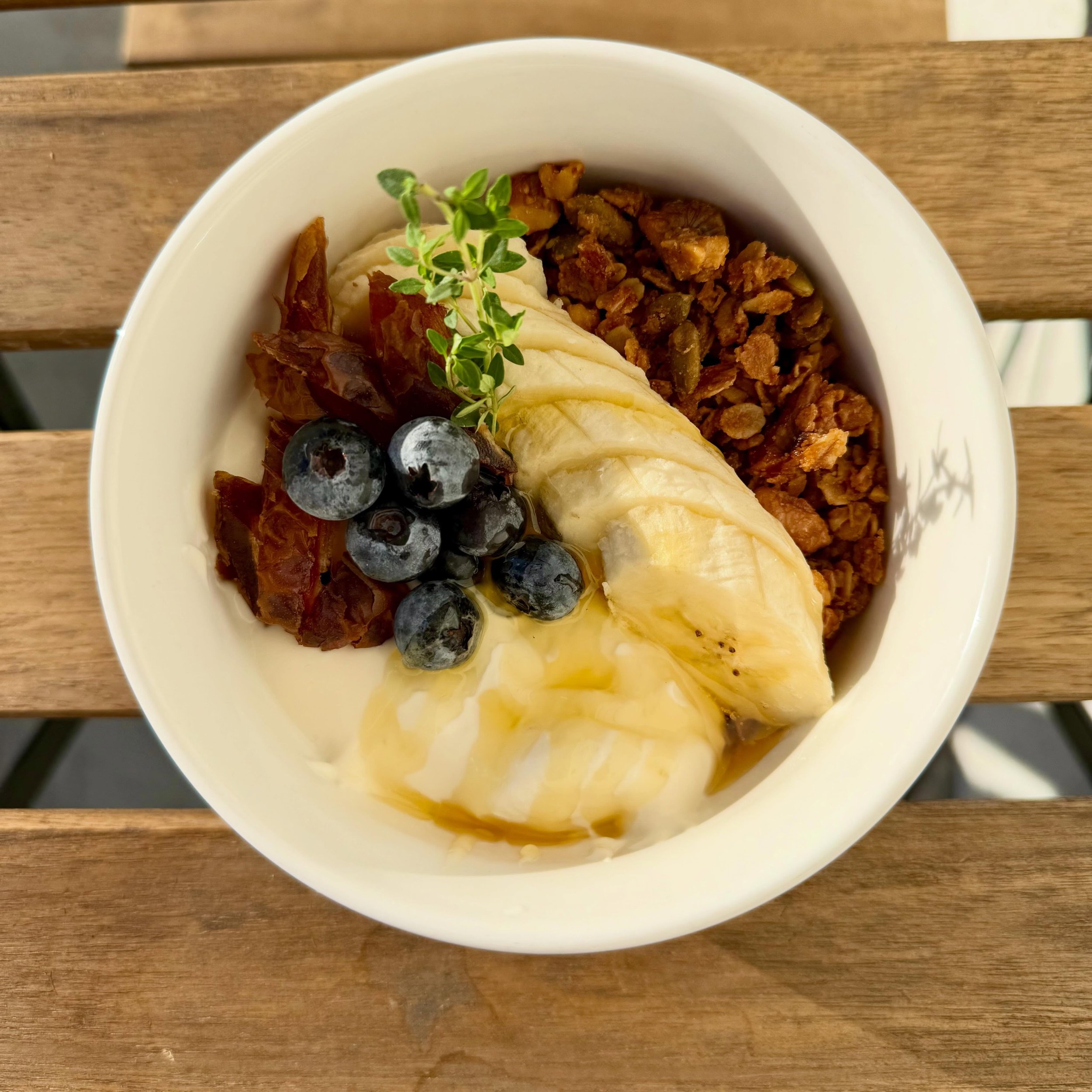 Our yogurt and granola bowl features our house-made granola, honey yogurt, chopped dates, and fresh fruit!
