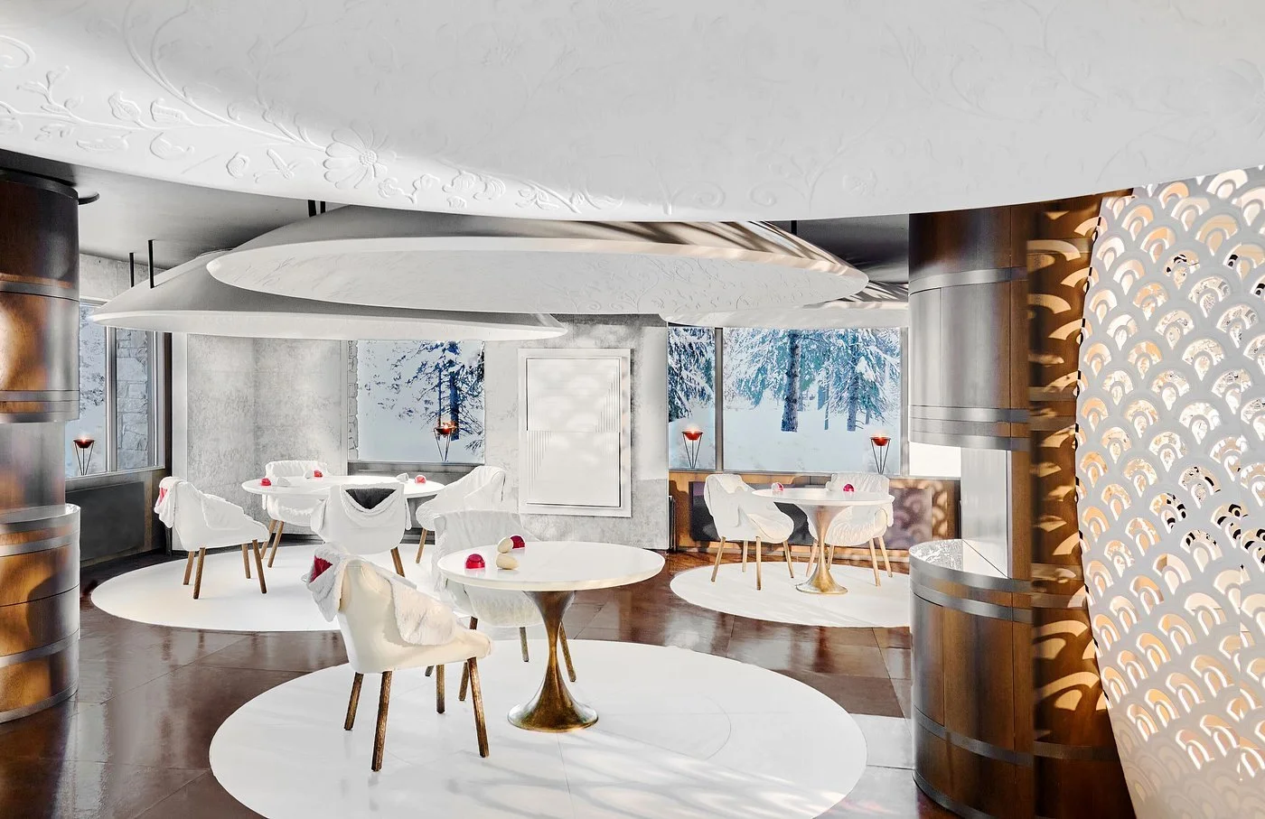 Modern restaurant interior with white chairs and tables decorated with small ornaments, large windows showing snowy landscape, and decorative ceiling panels.