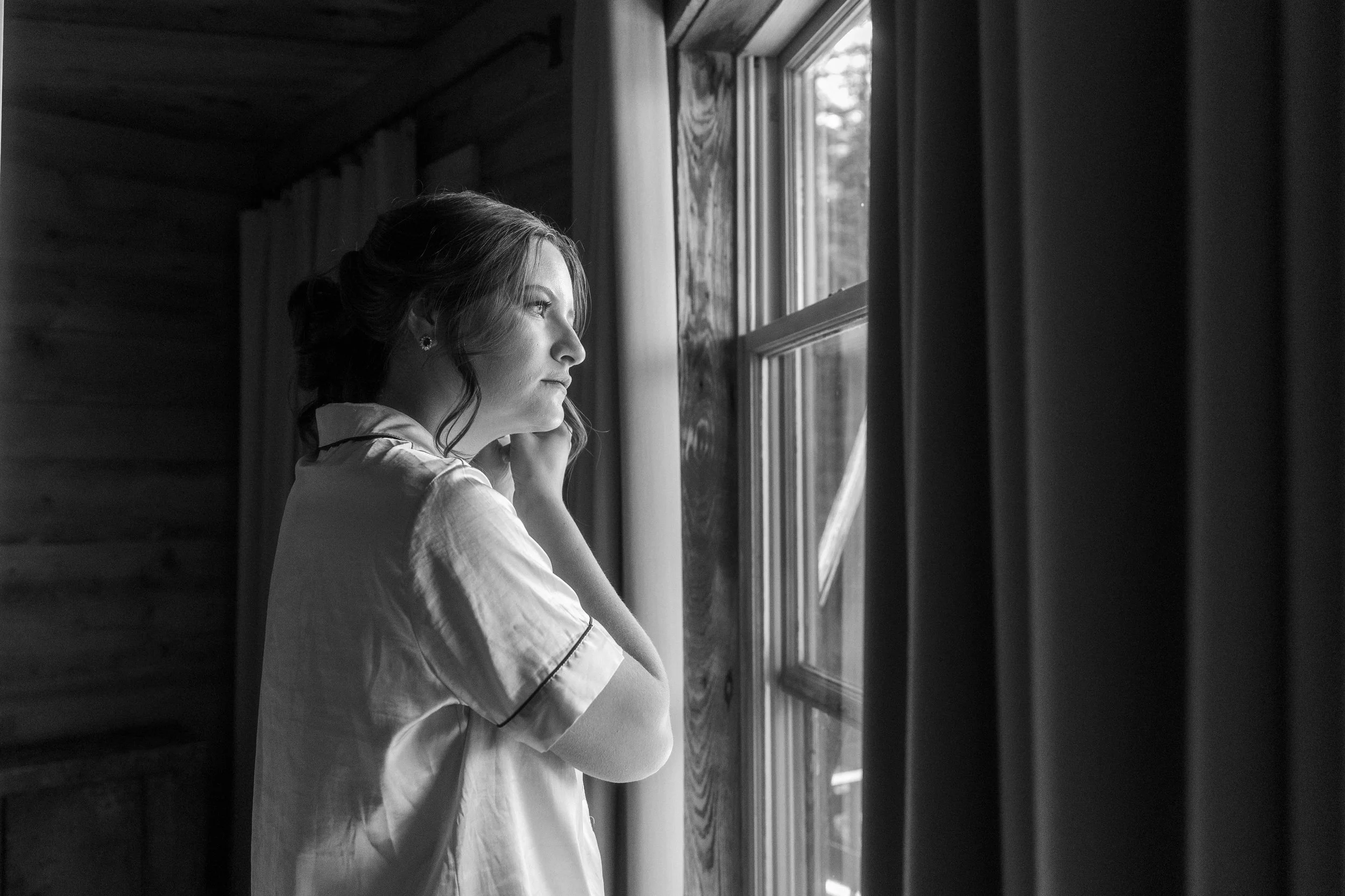 A bride putting on her earrings at her wedding in Crested Butte, Colorado