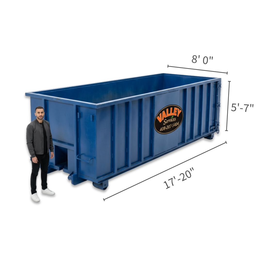 Portable toilets with Valley Services branding in an outdoor setting.