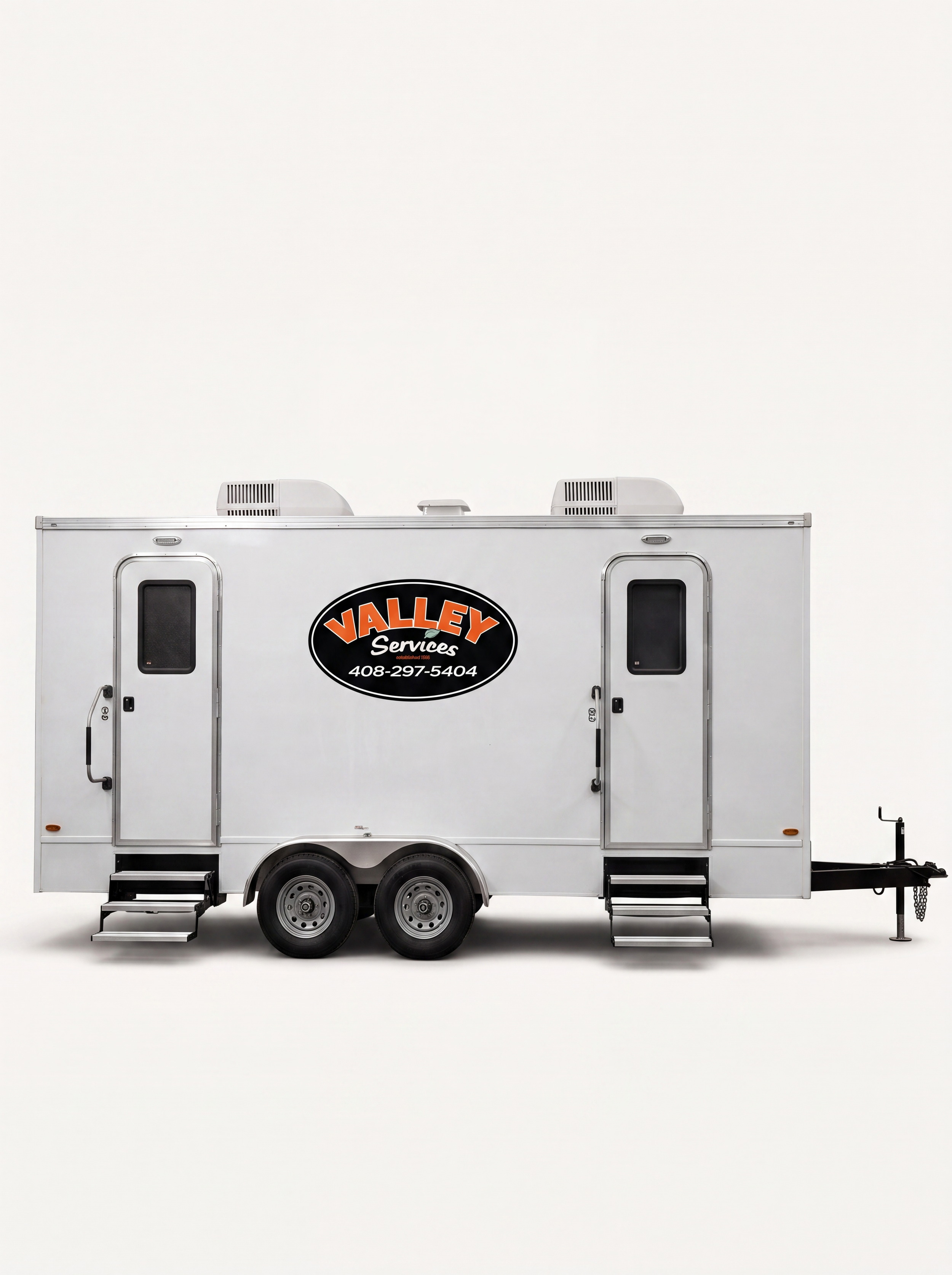 white portable restroom trailer with two steps and dual axle wheels